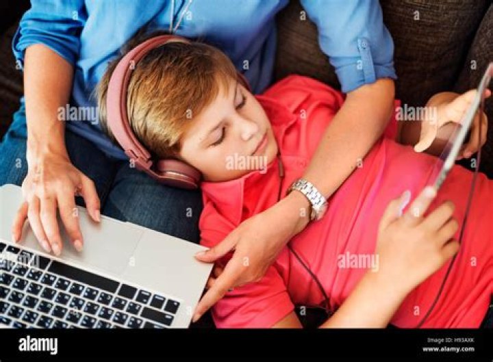 Mom Son Holidays Using Electronics Multimedia Concept Stock Photo