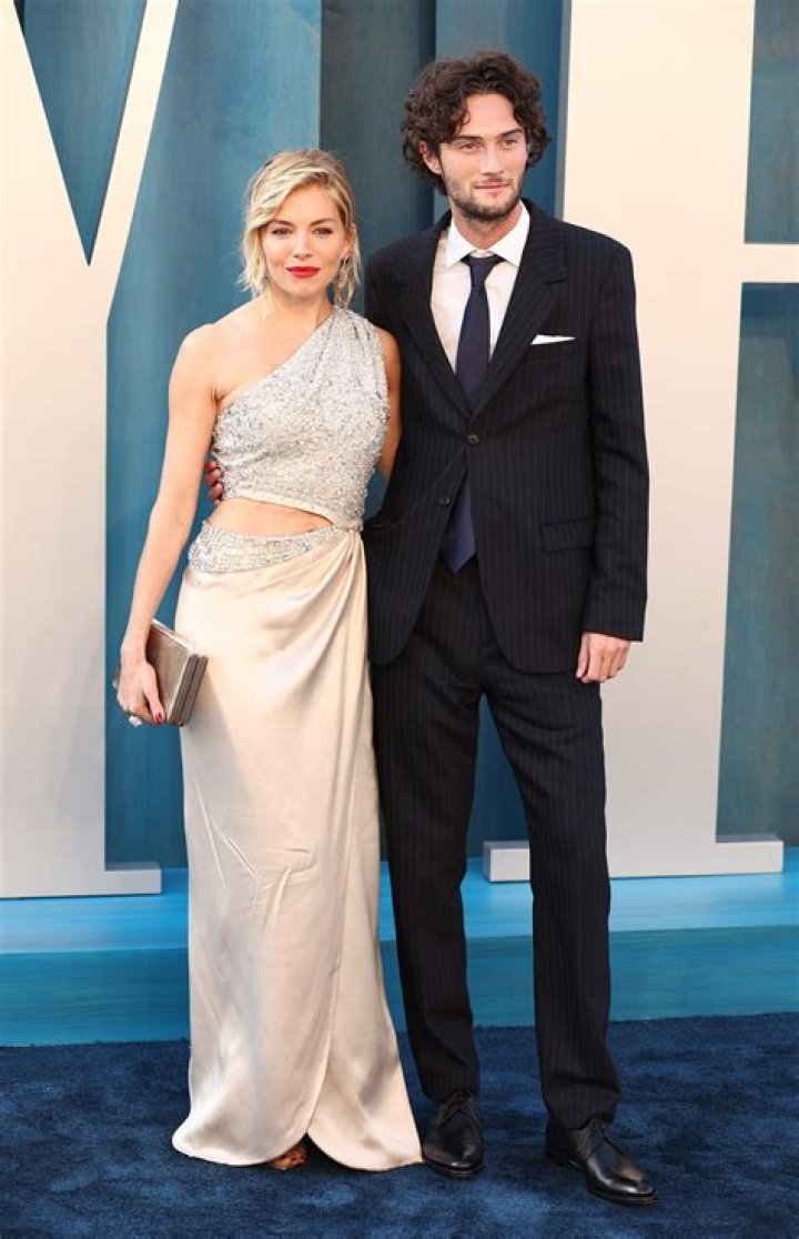 Sienna Miller with her fiance Tom Sturridge and daughter Marlowe